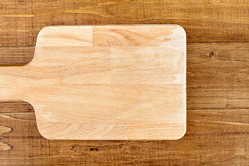 cutting board close-up on a wooden table. View from above