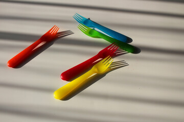 multicolored forks on a light background