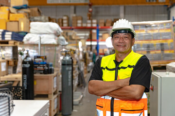 Southeast asia staff engineer worker man portrait confident happy smiling arm crossed in factory...