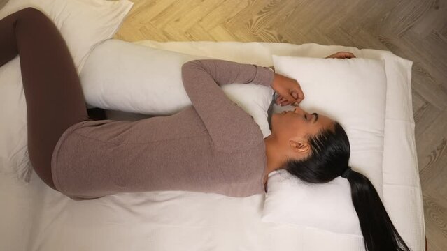woman sleeping on her side with the correct physiological posture. top view
