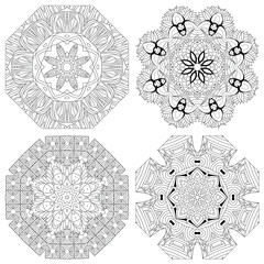Hand drawn zentangle set of 4 mandalas for coloring page.