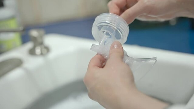 Cleaning and setting up breast pump.