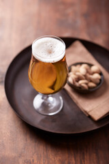Glass of beer on wooden background. Copy space. 