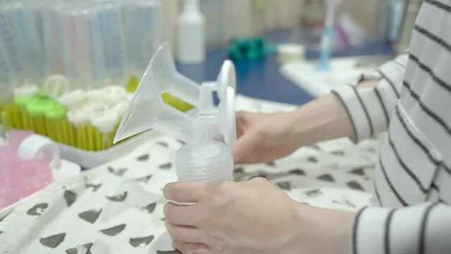 Cleaning and setting up breast pump.