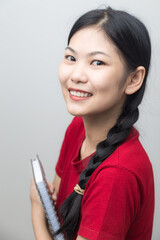 Smiling asian women casual red shirt on white background