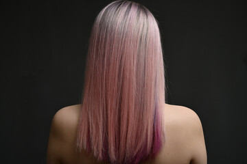 Fototapeta premium Portrait Of A Beautiful Young Blond Woman With Long Straight Hair. Back View.