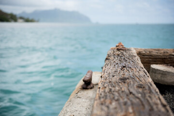 Hawaii Fishing Pier on a cloudy day overlooking the ocean.