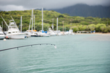 Fototapeta premium Hawaii Fishing Pier on a cloudy day overlooking the ocean.