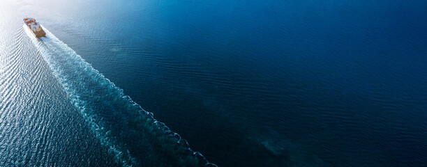 webinar banner, Aerial top view of cargo maritime ship with contrail in the ocean ship carrying...