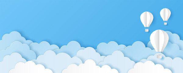 Paper art style of clouds with hot air balloons on blue sky background. Vector illustration