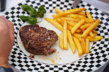 beef steak with french fries garnish. food concept.