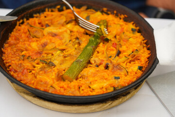 Traditional Spanish paella with seafood and chicken. Prepared in wook.