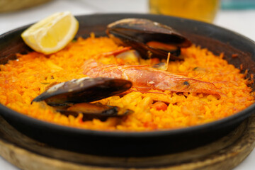 Traditional Spanish paella with seafood and chicken. Prepared in wook.