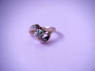 Gold diamond ring on pink isolated background. Red Gold Ring