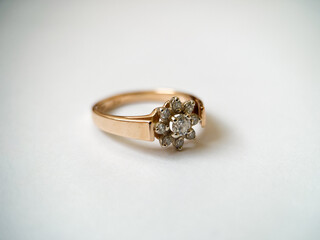 Gold diamond ring on a white isolated background. Red Gold Ring