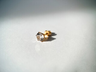 Gold stud earrings with cubic zirconia close-up