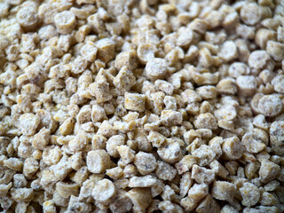 Background of corn filler for a cat's toilet. Corn filler granules close-up