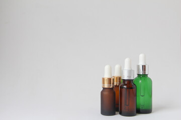 Facial essential oil or serum packaging on white background. Beauty cosmetic product for skincare concept.