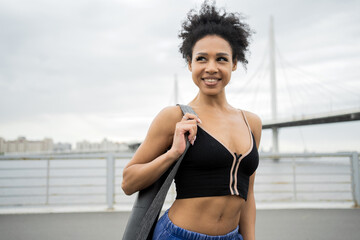 Sportswoman fitness in the city in sportswear, training and an active lifestyle.