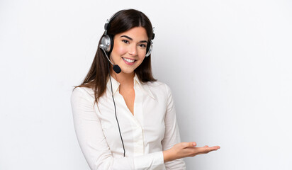 Telemarketer caucasian woman working with a headset isolated on white background presenting an idea while looking smiling towards - obrazy, fototapety, plakaty