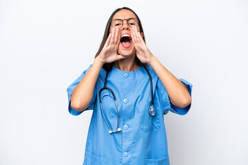 Young surgeon doctor woman isolated on white background shouting and announcing something