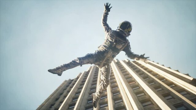 An astronaut falls from space to earth. Astronaut's flight past skyscrapers. Space traveler returns after space voyage. The animation is perfect for space, sci-fi and fantasy backgrounds.
