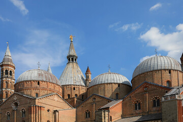 Many domes and a Golden Angel on the top of the famous Basilica of Saint Anthony in the city of Padua in Italy - obrazy, fototapety, plakaty