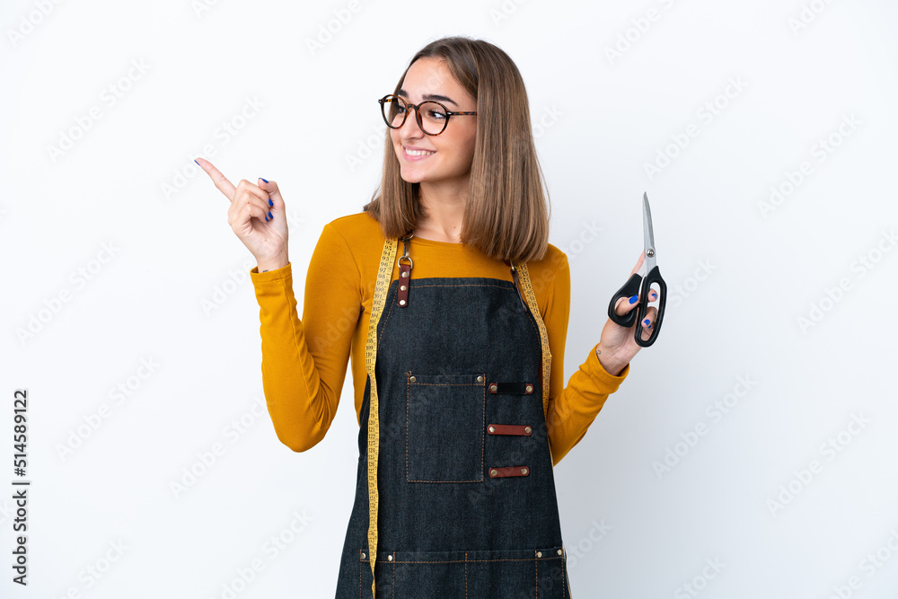 Wall mural young caucasian sewing box woman isolated on white background pointing up a great idea