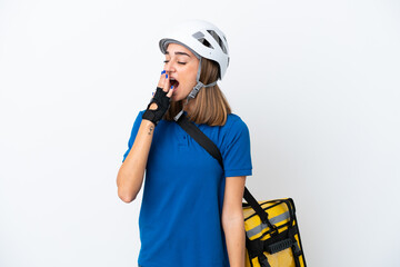 Young caucasian woman with thermal backpack isolated on white background yawning and covering wide open mouth with hand