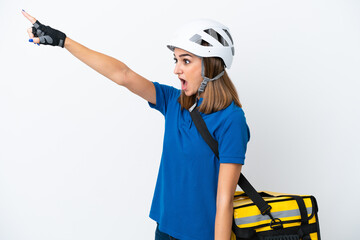 Young caucasian woman with thermal backpack isolated on white background pointing away