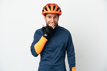 Young cyclist man isolated on white background happy and smiling covering mouth with hand