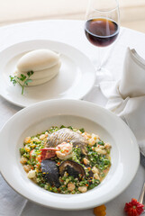 Nigerian seafood okra or okro soup served with pounded yam or fufu and red wine