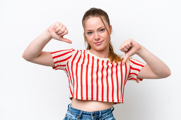 Young caucasian girl isolated on white background showing thumb down with two hands