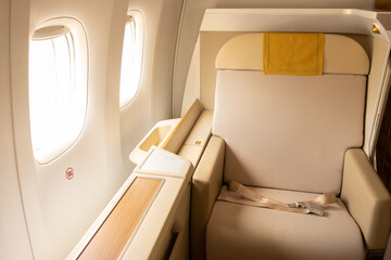 Luxury first or business class suite in gold color feel private for travel. Business comfort and elegance chair when fly with airline.
