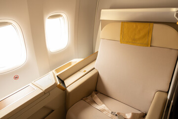 Luxury first or business class suite in gold color feel private for travel. Business comfort and elegance chair when fly with airline.