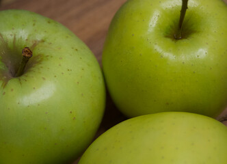 Renet simirenko green apples, top view, close-up. Macro shot of fruit.