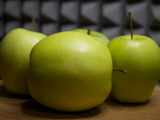Several green apples, side view. Fruit close-up.