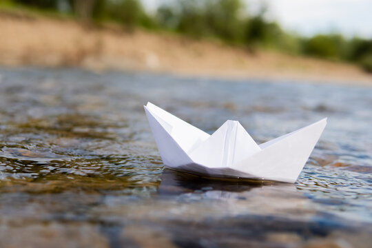 paper boat floating in the river