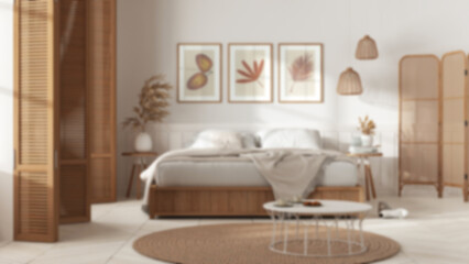 Fototapeta na wymiar Blurred background, country bedroom. Mater bed with blanket. Wooden panel and parquet floor, carpet and table, breakfast with cookies. Interior design