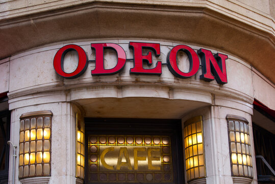 Entrance of famous Cafe Odeon on a cloudy summer day with red neon letters. Photo taken June 28th, 2022, Zurich, Switzerland.