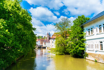 Fototapeta na wymiar Germany, Old town houses of esslingen am neckar city in summer with blue sky and sun next to neckar river water, a tourism destination famous and popular