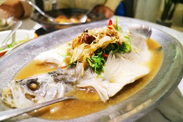 Freshly cooked seabass dishes served on the iron plate