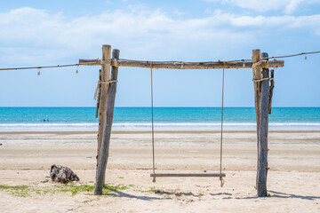 home made swing on the beach
