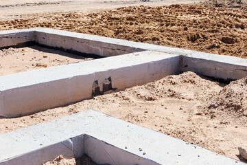 Strip foundation of a new building. The foundation for the construction of the walls of the house.
