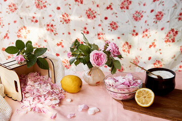 Homemade natural tea rose jam preparing with sugar, lemon and tea rose petals. Healthy recipe. Lifestyle photography. 