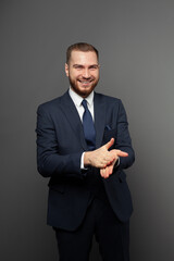 Happy attractive young businessman wearing suit portrait