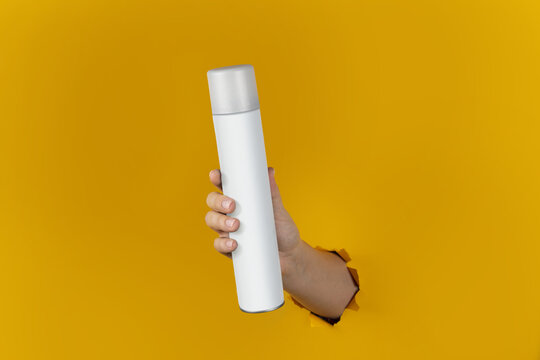 Spray or Bottle in the hand. Beauty conception. For Advertisment and Branding Photo Clipart 
