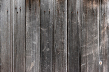 Fototapeta premium Old wooden planks background texture.Vertical boards with nails