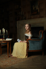 Young woman actress or singer sitting in vintage interior, retro portrait
