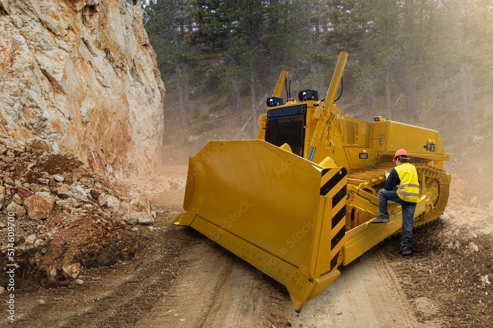 Aufkleber engineer programs autonomous bulldozer using digital tablet